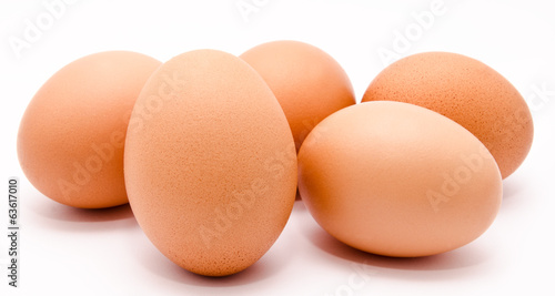 Brown chicken eggs isolated on a white background closeup
