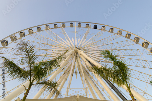 Beautiful large Ferris wheel. And the blue sky. © chokniti