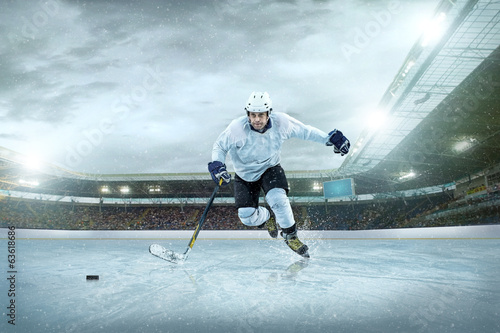 Ice hockey player on the ice. Open stadium - Winter Classic game