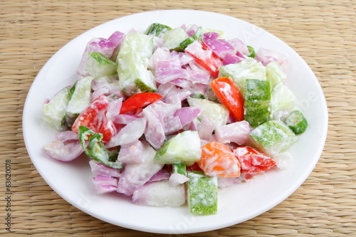 Vegetable salad with cucumber,carrots onion .