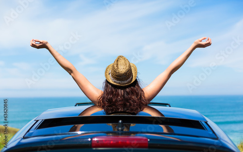 Woman on car travel freedom enjoying freedom photo
