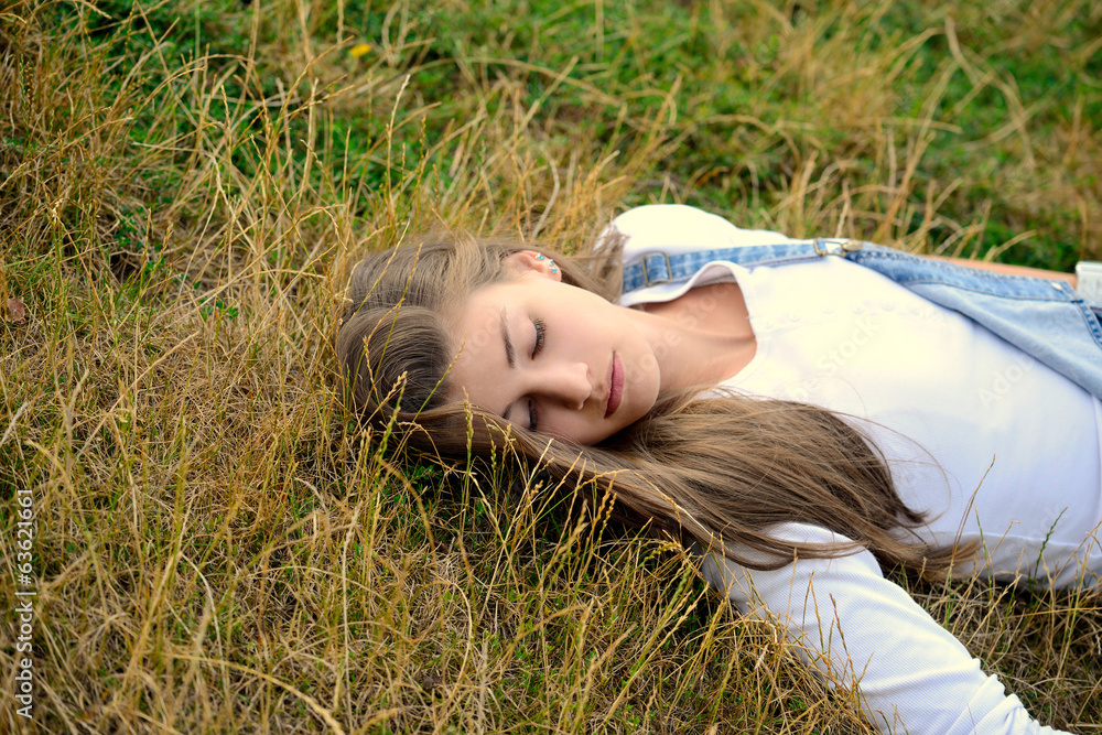 Beautiful Young Woman Lying On Dry Grass Beautiful Young Woman Lying On Dry Grass