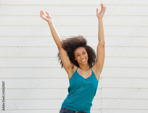 Woman with arms up in the air