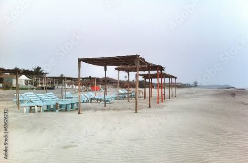 sun tents and beds at the empty beach