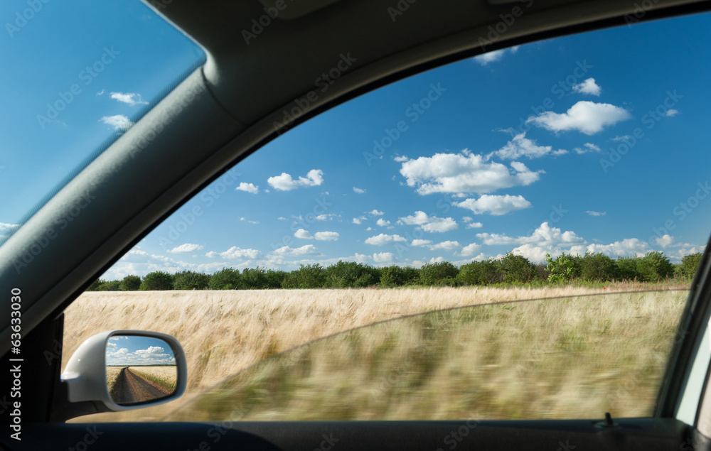 view from car window on wheat field view from car window on wheat field
