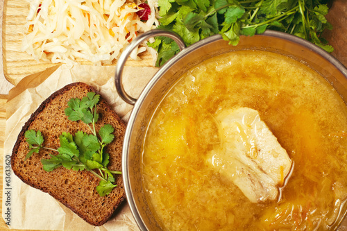 Meat soup with sour-crout (sauerkraut, cabbage), fresh parsley photo