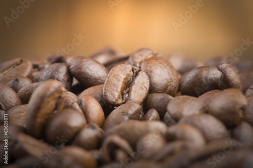 Coffee beans and leaves on the wood table