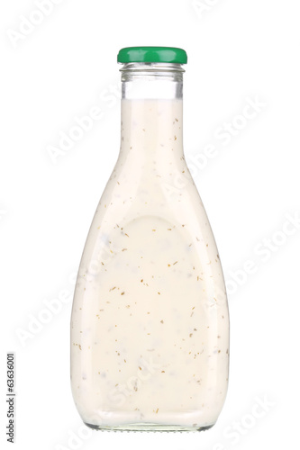 Glass bottle of white sauce. photo