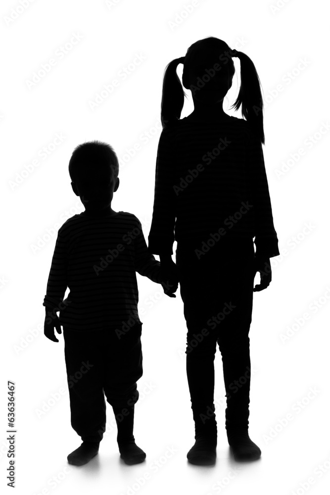 Silhouette of little girl and boy