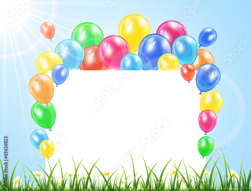Balloons and banner on a grass