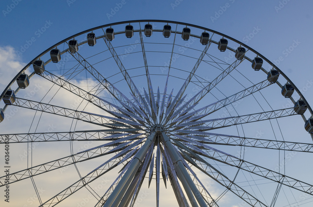 Beautiful large Ferris wheel. And the blue sky. Beautiful large Ferris wheel. And the blue sky.