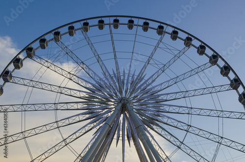 Beautiful large Ferris wheel. And the blue sky.