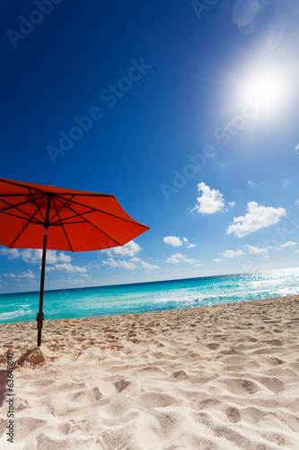 Sun and umbrella on the beach