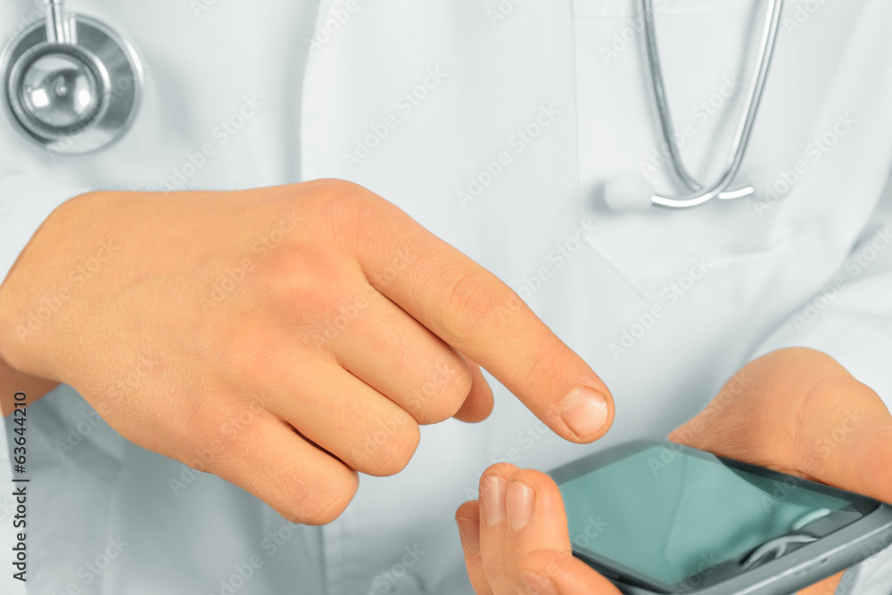 Unrecognizable doctor with mobile phone Unrecognizable doctor with mobile phone