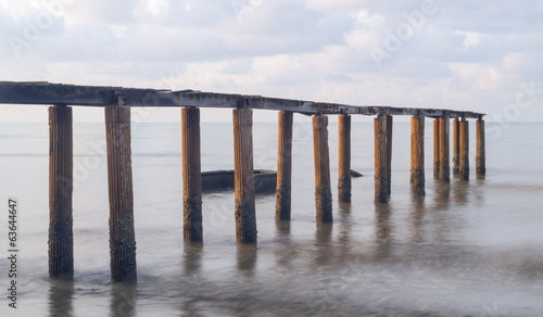 Old Bridge During Sunrise at tropical sea  Thailand