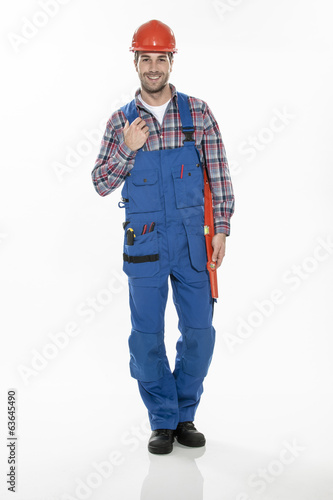 portrait of a craftsman with an hardhat and a level on isolated