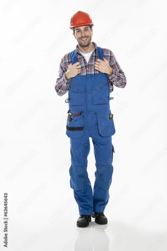 Portrait of a craftsman in workwear clothing with an hardhat on