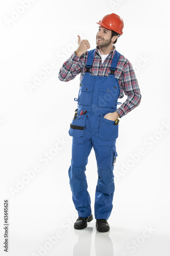 Portrait of a craftsman in workwear clothing with an hardhat on