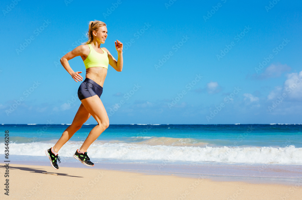 Athletic Woman Running on the Beach