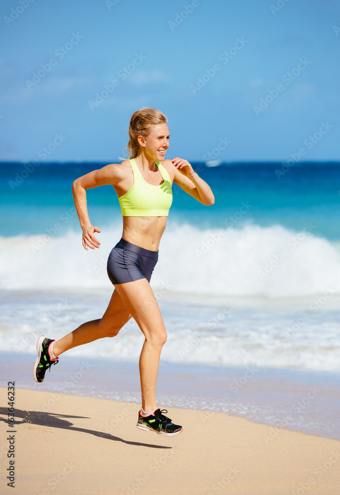 Athletic Young Woman Running on the Beach Athletic Young Woman Running on the Beach