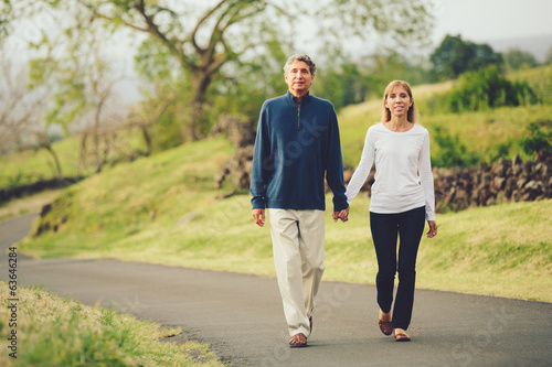 Happy loving middle aged couple walking © EpicStockMedia