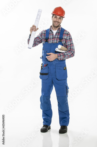 a craftsman in workwear clothing with an hardhat and blueprints