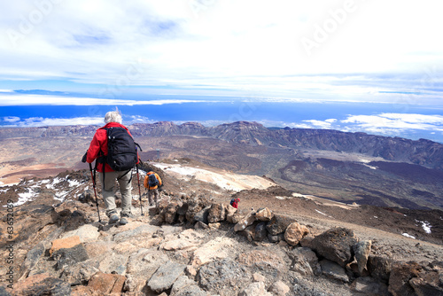 Man at mountain landscape near volcano Teide descending