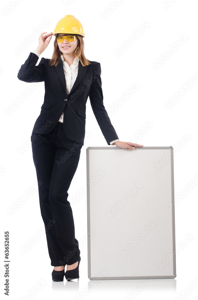 Pretty businesswoman with hard hat and blank board isolated on Pretty businesswoman with hard hat and blank board isolated on