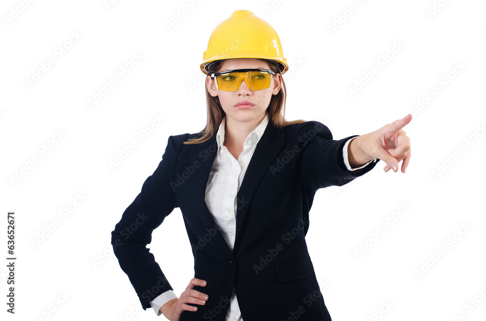 Pretty businesswoman with hard hat pressing virtual buttons is Pretty businesswoman with hard hat pressing virtual buttons is
