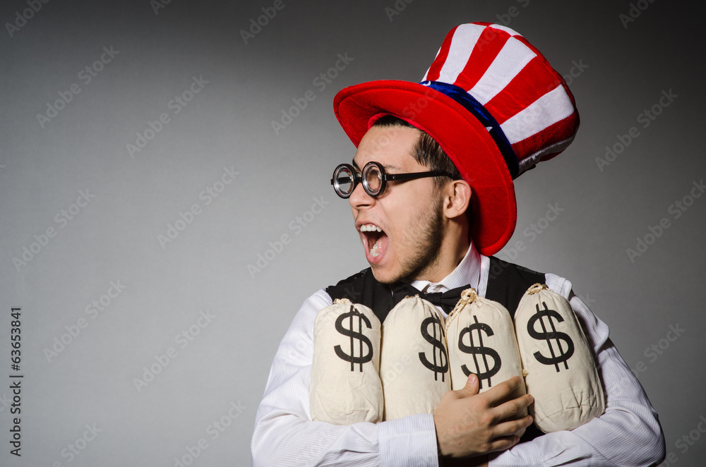 Funny man with american hat and sacks of money Funny man with american hat and sacks of money