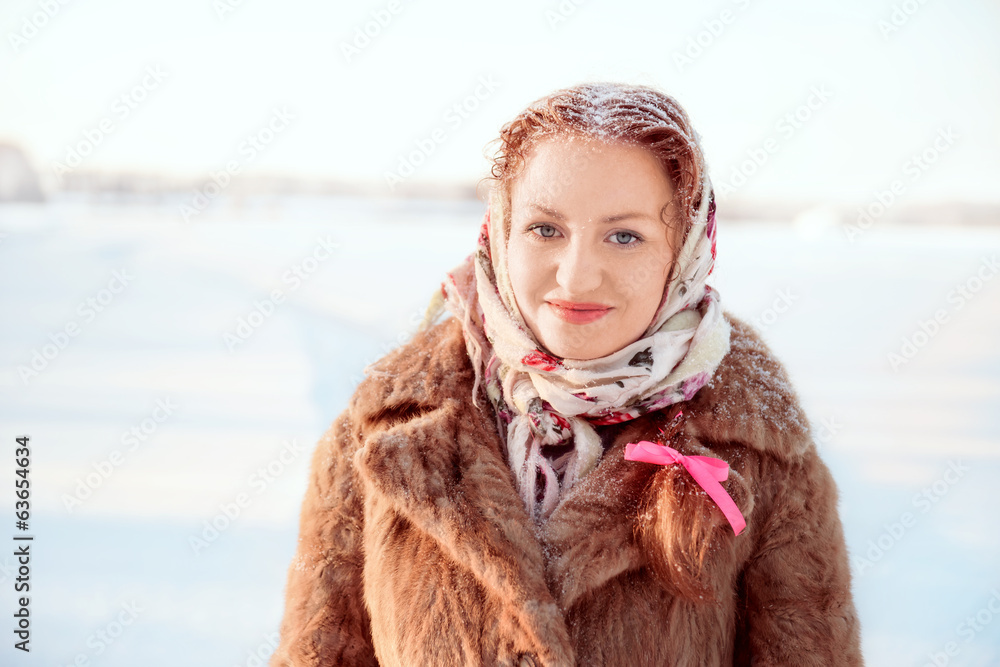 Outdoor portrait of young pretty woman on sunny winter landscape Outdoor portrait of young pretty woman on sunny winter landscape