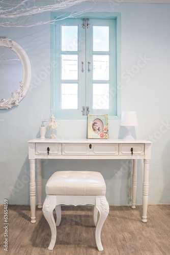 Vintage white wooden vanity table, chair and mirror photo