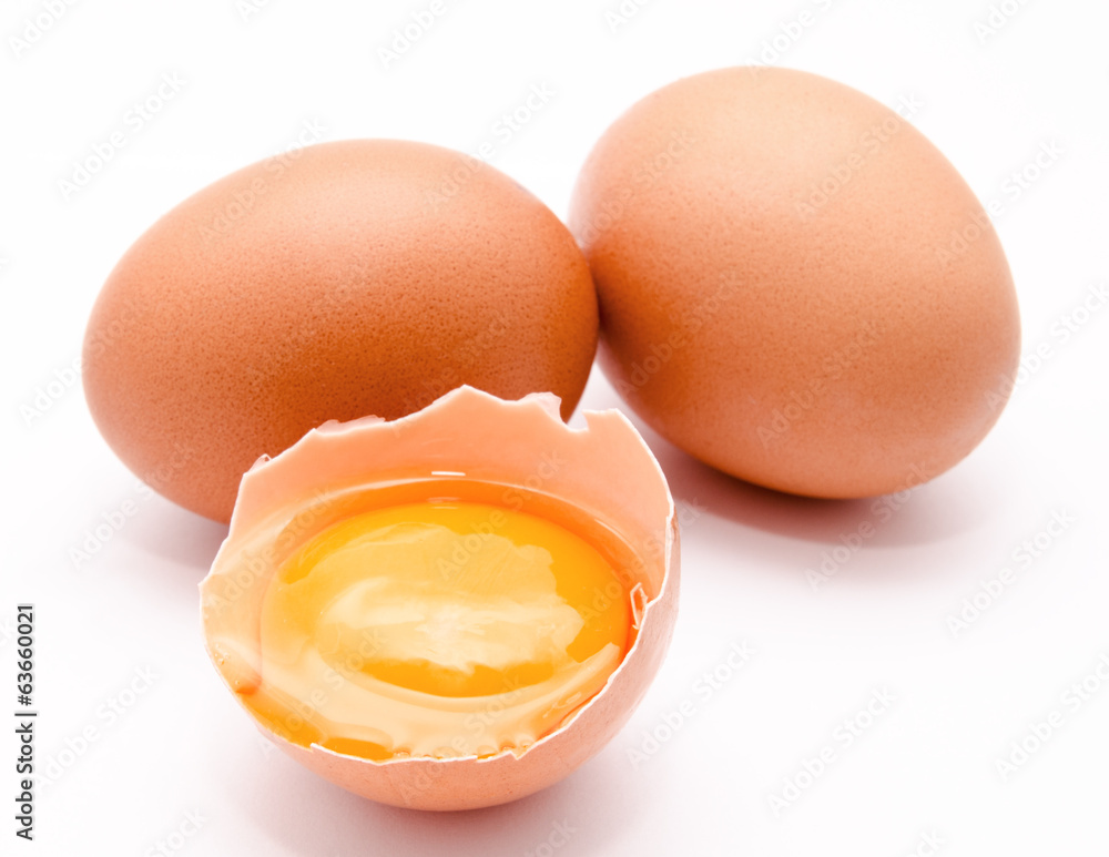 Broken and whole chicken eggs with yolk isolated Broken and whole chicken eggs with yolk isolated