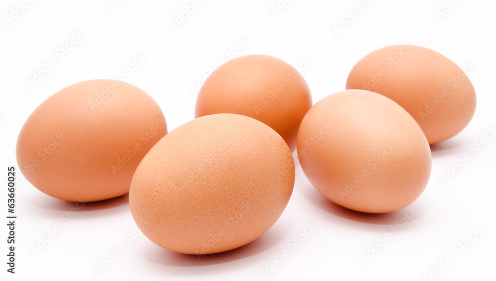 Five brown chicken eggs isolated on a white background Five brown chicken eggs isolated on a white background