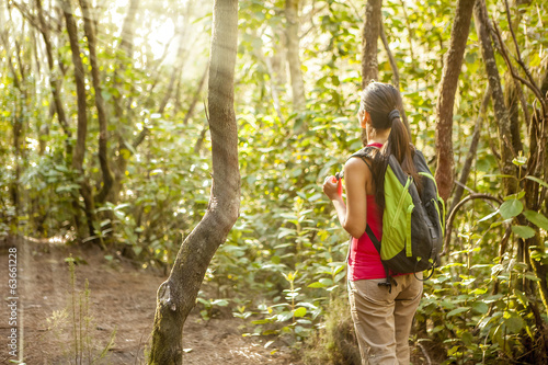 woman hiking in tropical forest