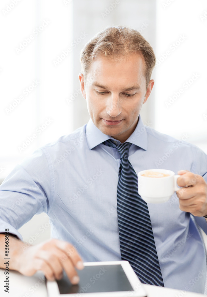 businessman with tablet pc and coffee in office businessman with tablet pc and coffee in office