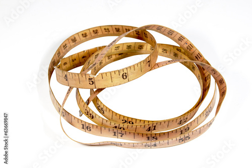 Studio Shot Coiled Vintage Tape Measure on White