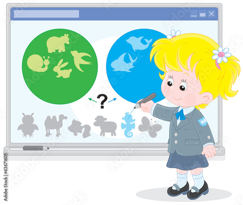 Schoolgirl works with an interactive whiteboard