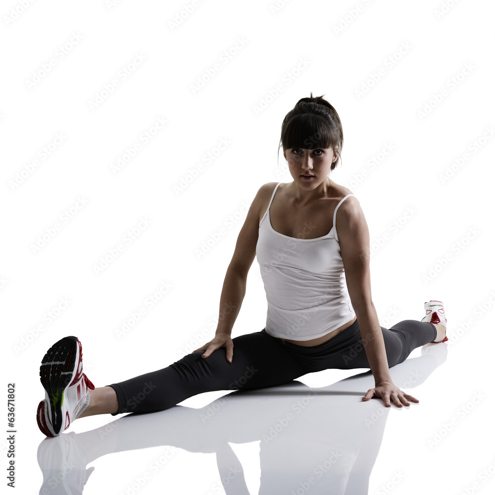 Fototapeta premium splits, portrait of sport girl doing yoga stretching exercise, s