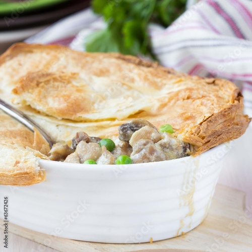 Meat pie with stew of chicken, mushrooms, peas, puff pastry