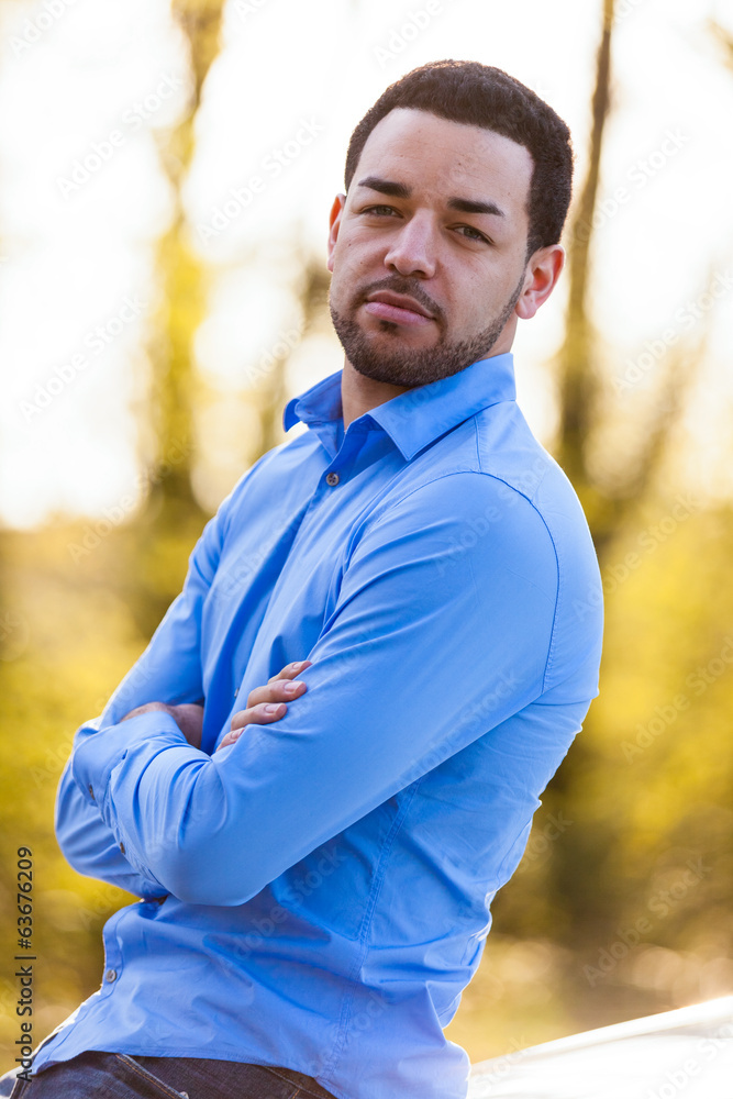 Outdoor portrait of a young latin american man