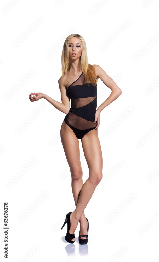Fashion photo of a beautiful and young woman in a swimsuit