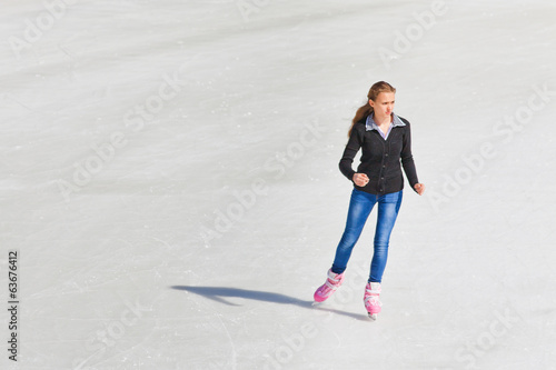 Young girl at the ice rink outdoor
