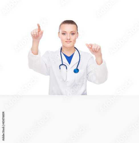 A professional doctor woman pushing an imaginary button