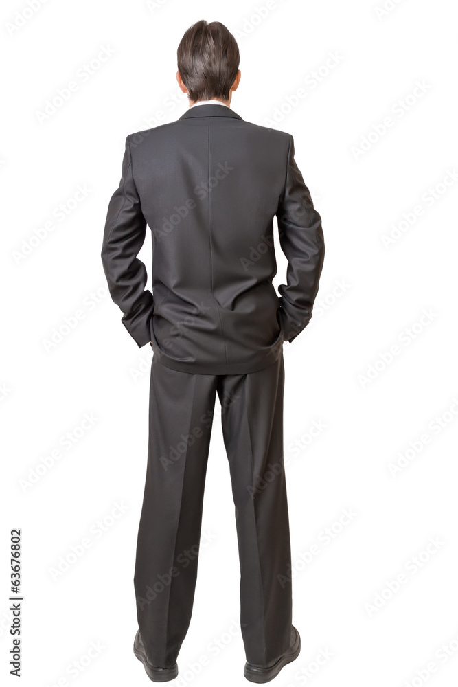 Backside of man in black suit keeping hands in pockets Backside of man in black suit keeping hands in pockets