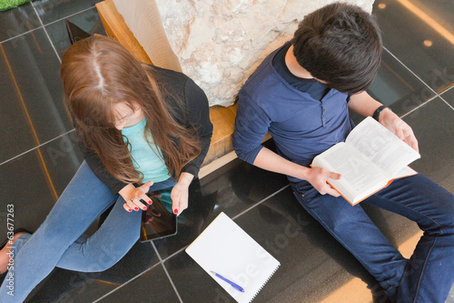 male and female university students sitting