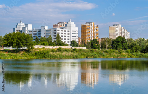 Residential buildings over a lake. Kyiv, Ukraine
