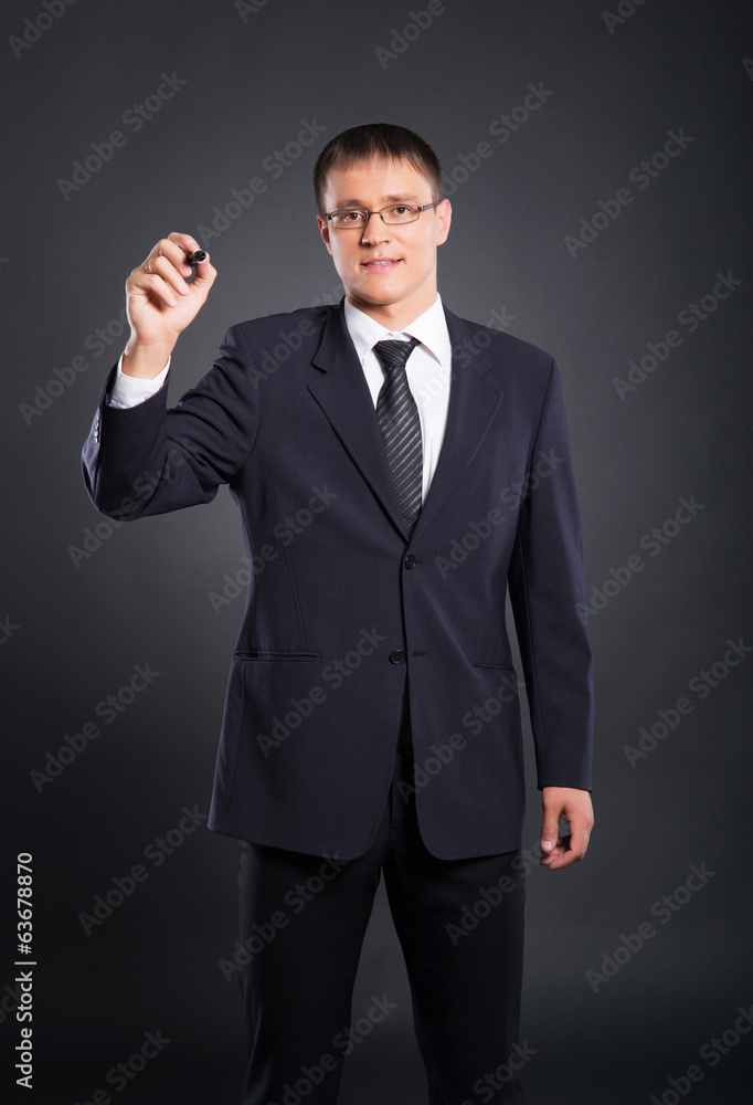 Successful and smart businessman writing imaginary text Successful and smart businessman writing imaginary text