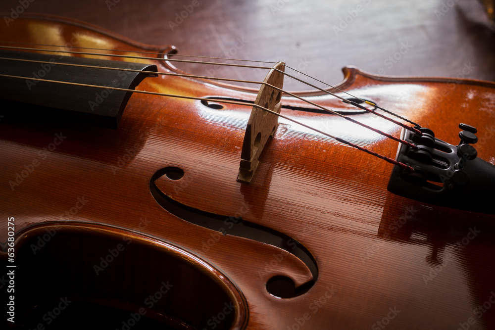 Fototapeta premium Still life violin on wood table.