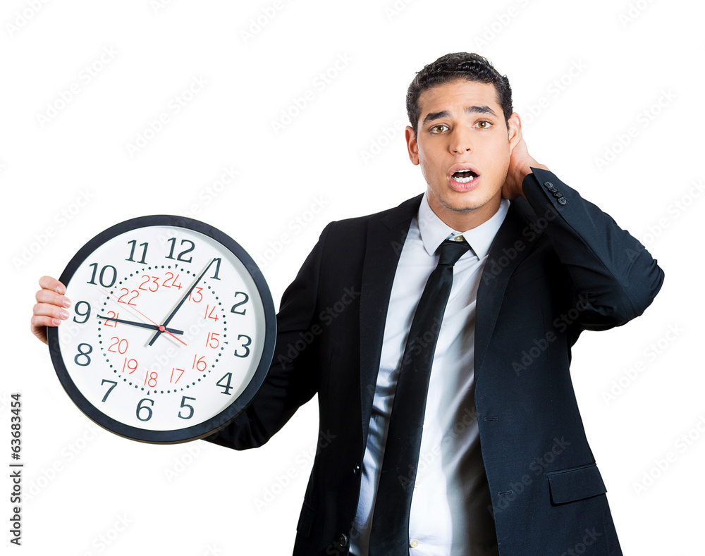 Businessperson running out of time, holding clock Businessperson running out of time, holding clock